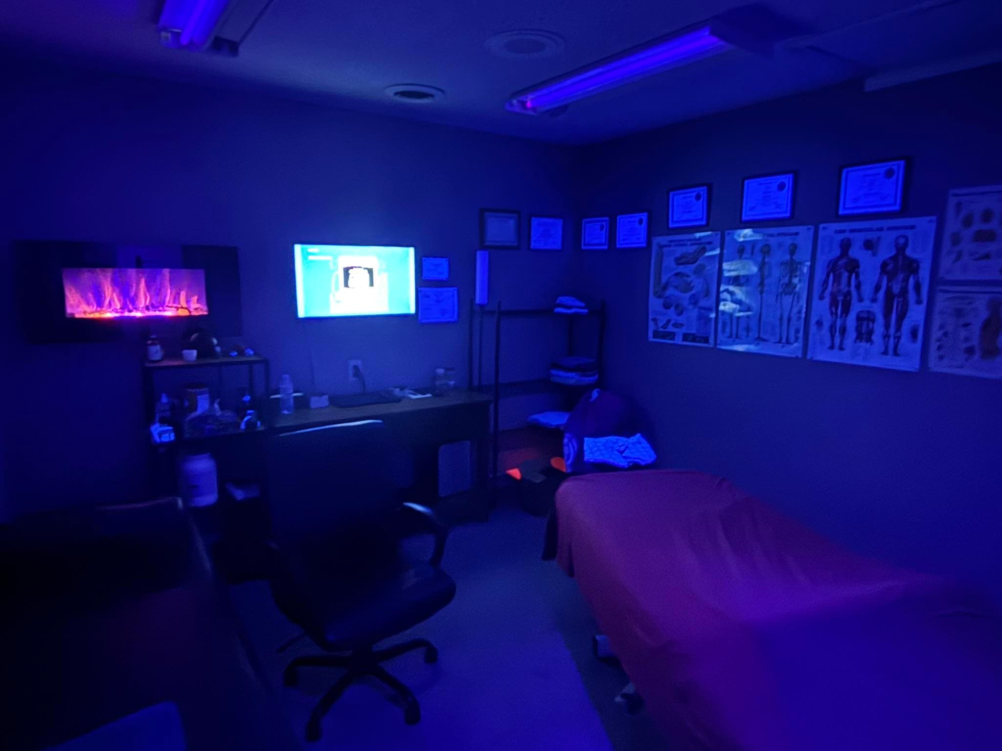 Muscle Movement and Improvement treatment room with low blue lighting