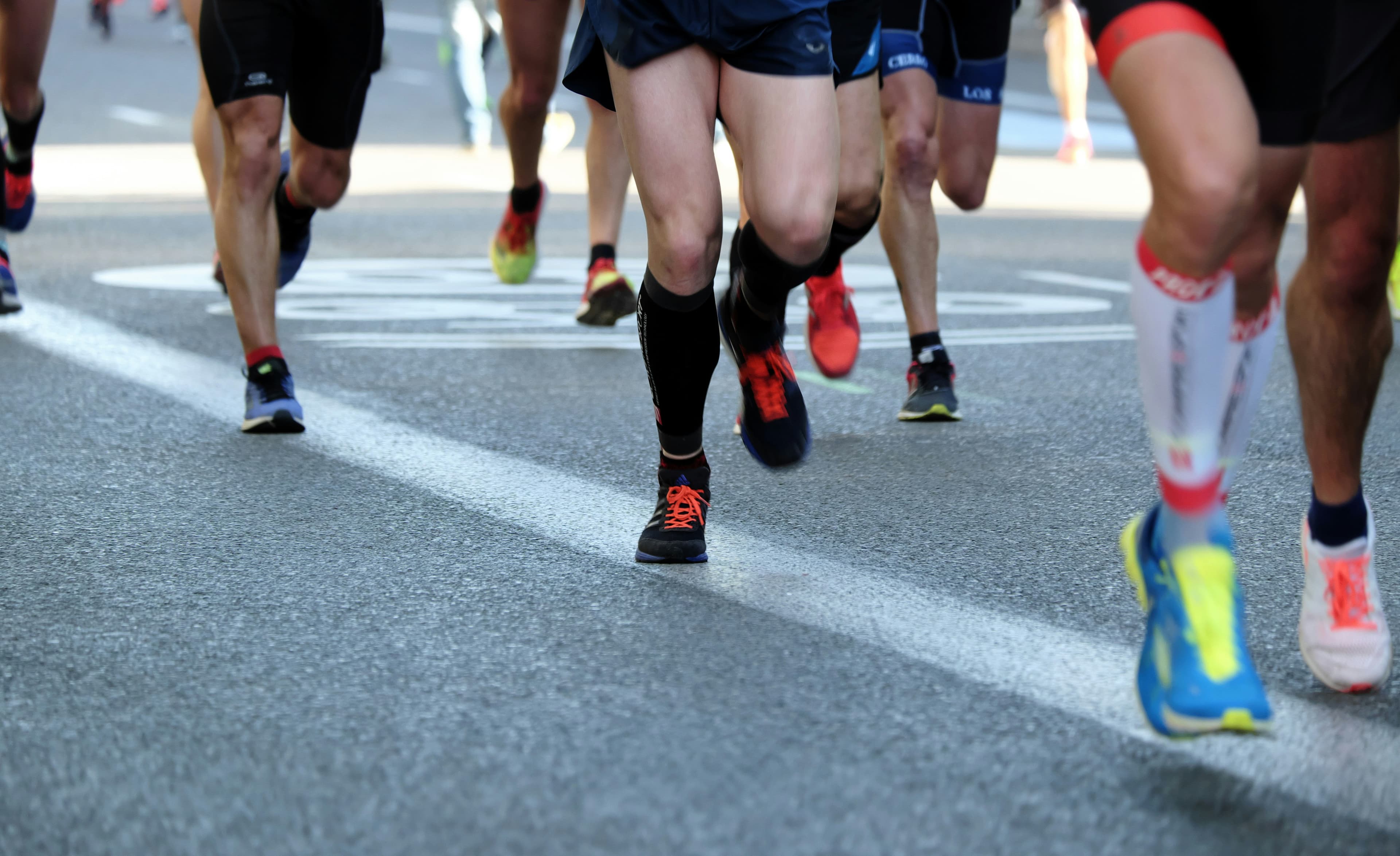 Runners moving together during a road race