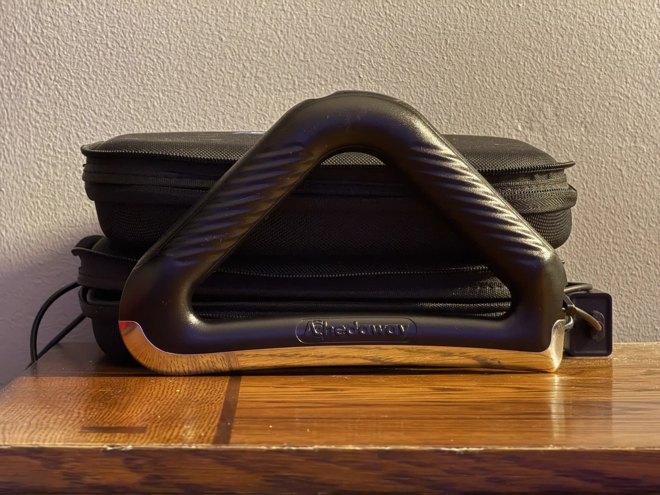 Powered bodywork tool stored with its cases in the MMI treatment room